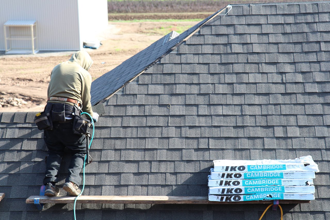 Male working on the roof.